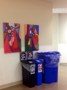 Paintings donated to BCWH placed above cans